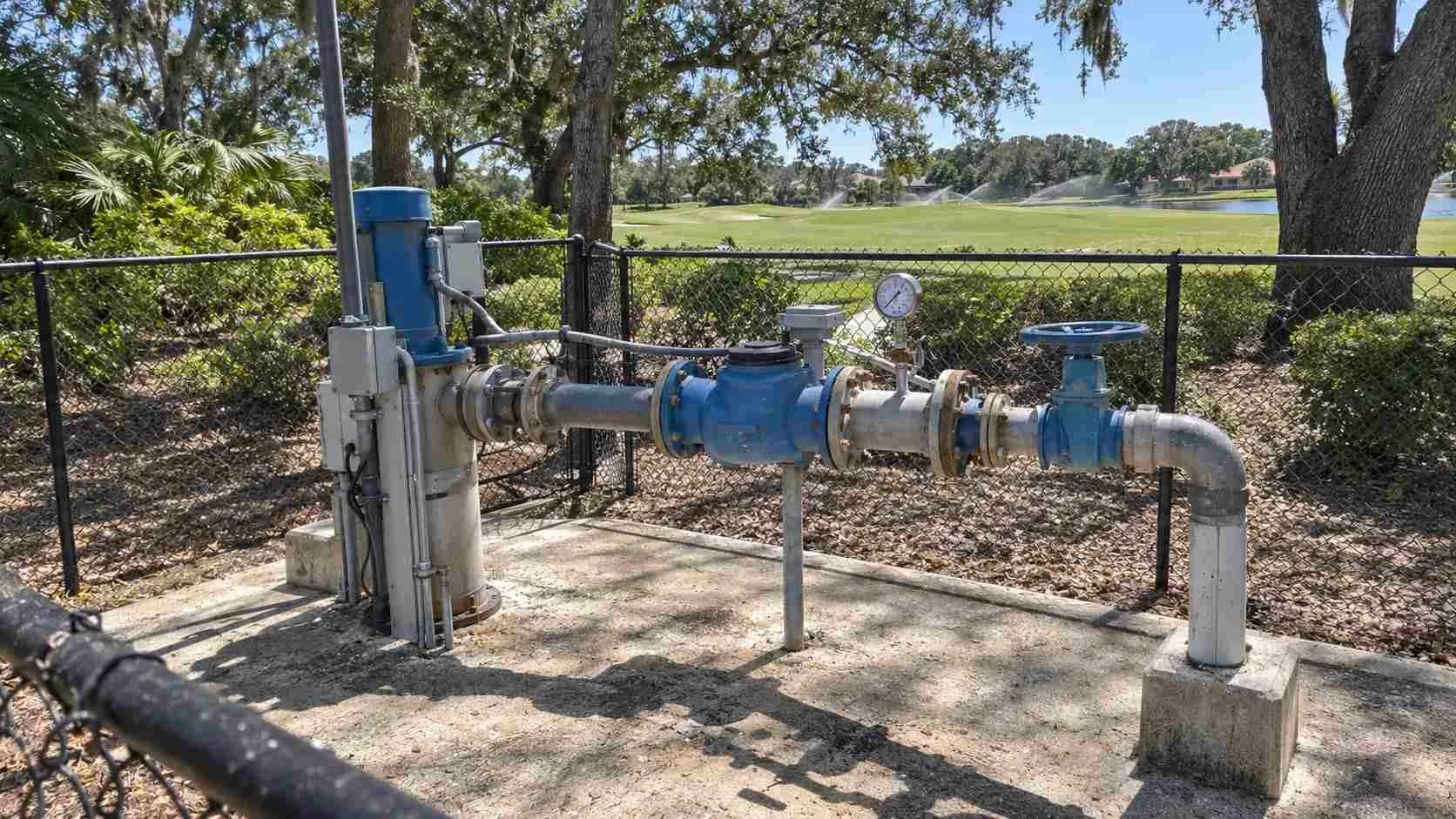 Purple pipe reclaimed water line feeding golf course irrigation