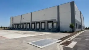 Dallas area food manufacturing facility exterior with loading docks, representing MES wastewater permit services.
