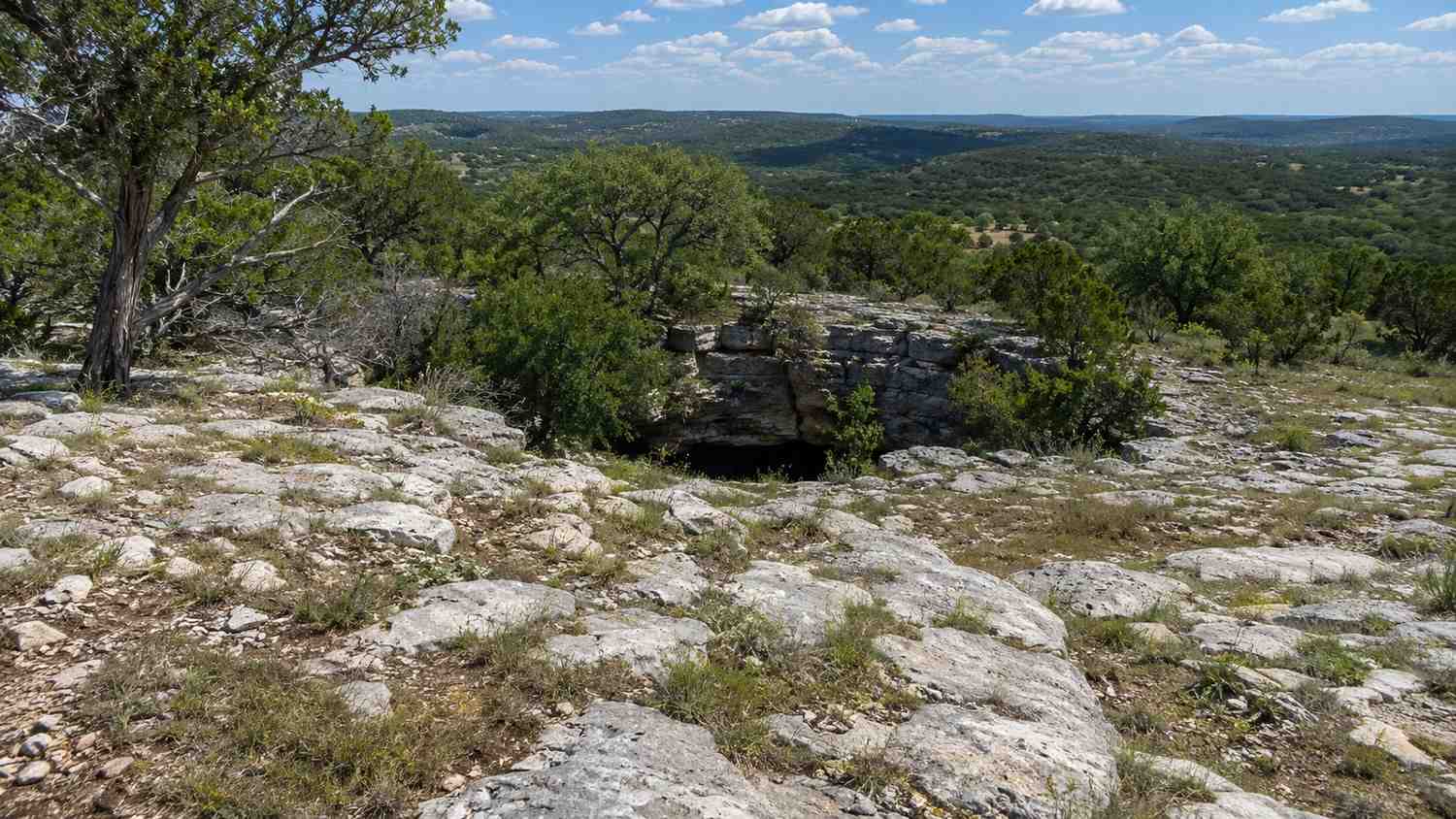 Exposed karst limestone recharge zone terrain in Austin area, representing MES Edwards Aquifer permitting services.