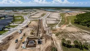 Aerial view of a Florida residential development with wastewater collection system and treatment facility under FDEP permitting evaluated by MES.