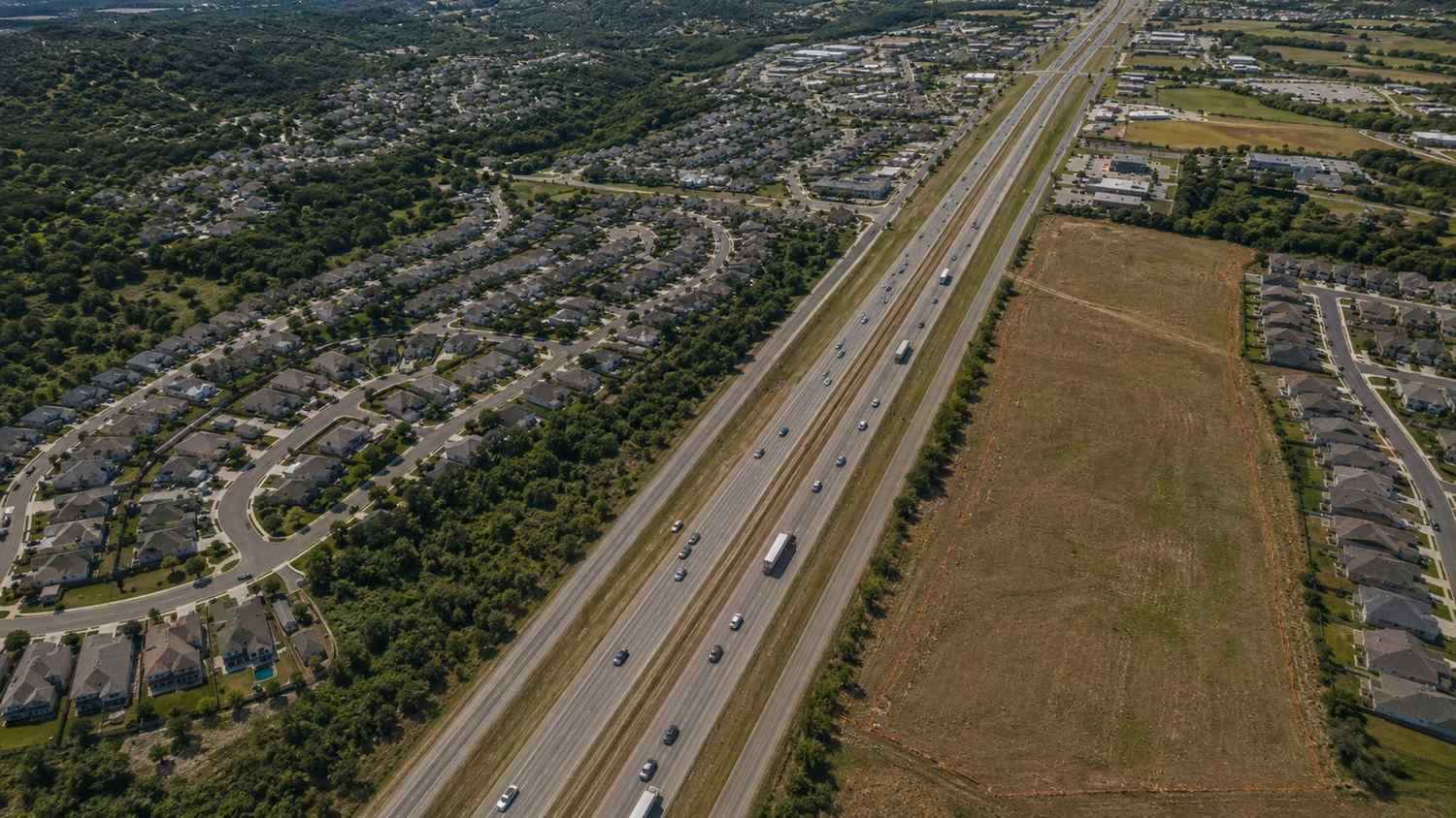 Aerial view of I-35 corridor development in Hays County Texas, representing MES TCEQ wastewater permitting services.