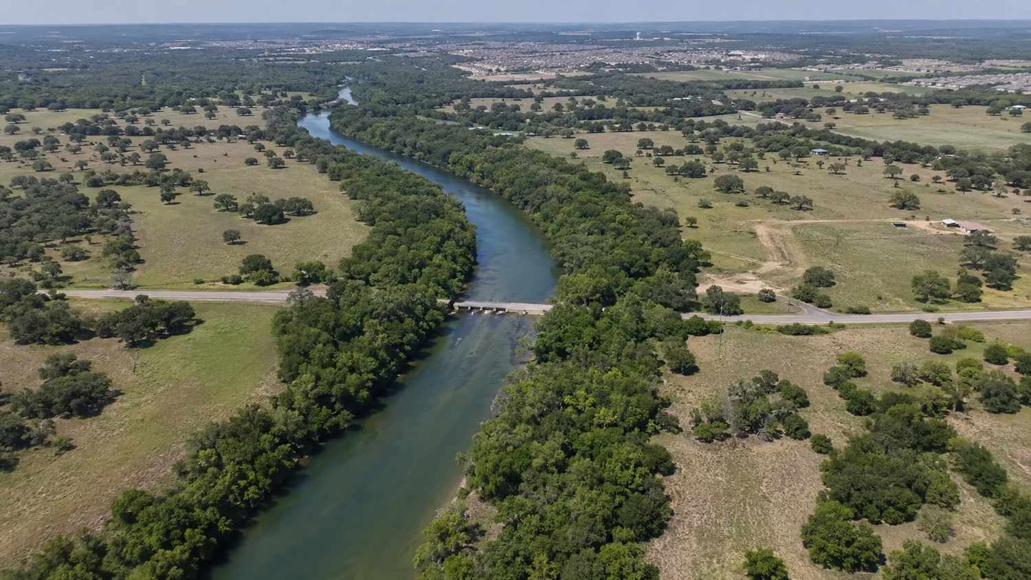 Colorado River and Highland Lakes reservoir serving Austin growth corridor, representing MES LCRA water rights evaluation.