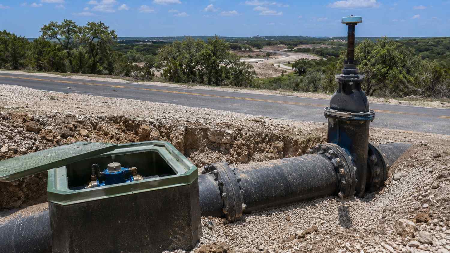 Water distribution main and valve assembly at Tarrant County development frontage, representing MES capacity evaluation.