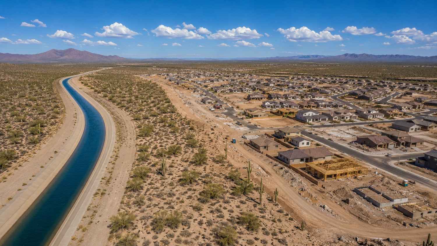 Aerial view of Arizona desert development beside a Central Arizona Project canal showing water scarcity constraints evaluated by MES.
