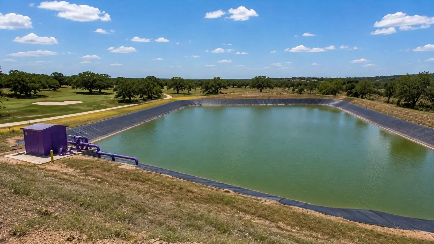 Reclaimed water seasonal storage irrigation pond at Central Texas master planned community, representing MES water balance design.