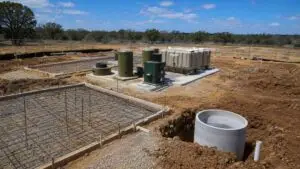 Private wastewater treatment plant under construction in Hays County Texas, representing MES TCEQ permit preparation.
