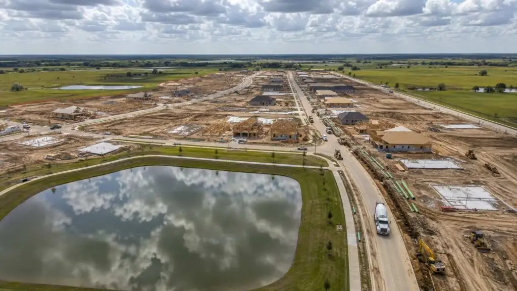 Aerial view of Houston suburban master planned community under development, representing MES MUD versus private plant evaluation.