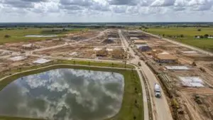 Aerial view of Houston suburban master planned community under development, representing MES MUD versus private plant evaluation.