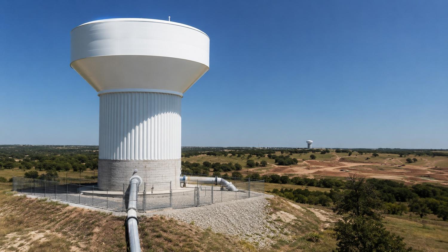 Elevated water storage tank serving McKinney Collin County pressure zone, representing MES storage siting coordination services.