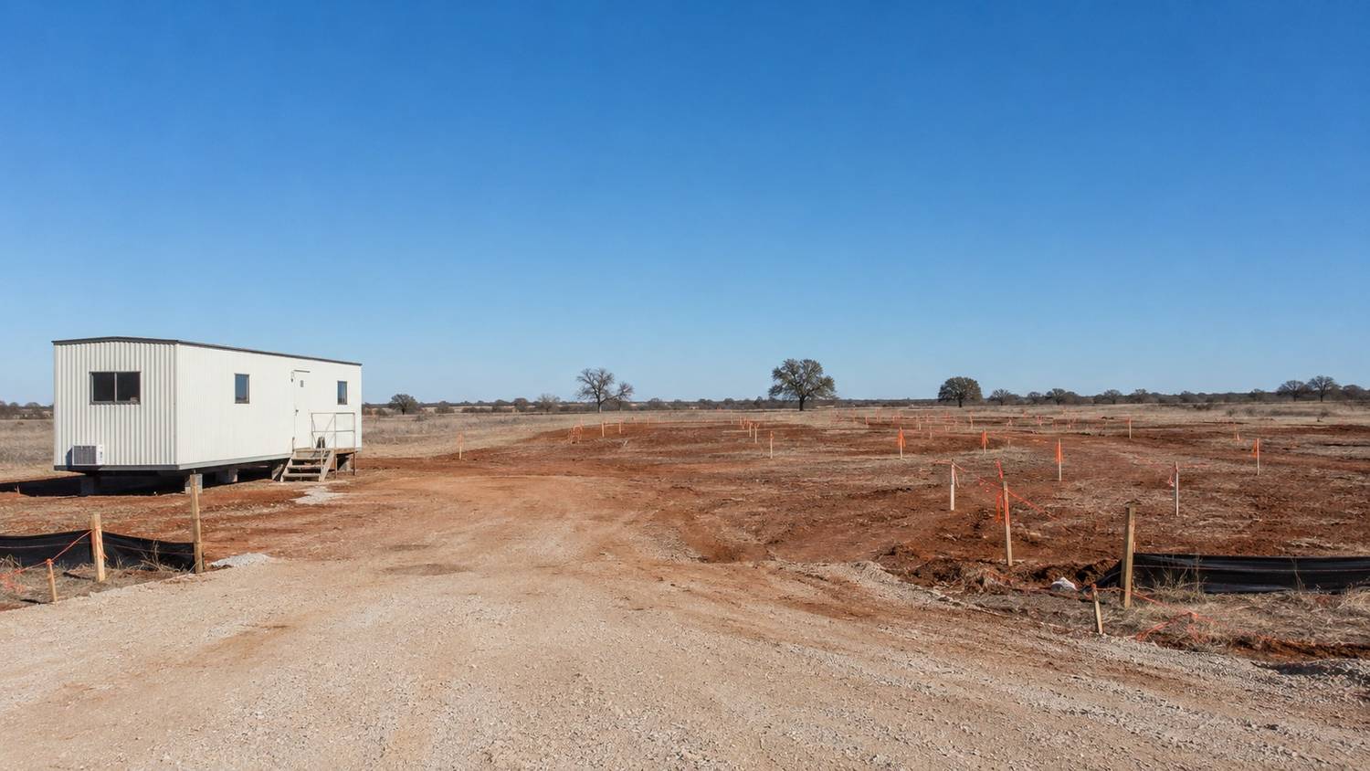 Texas development site carrying costs accumulating during TCEQ wastewater permit review, representing MES permit planning.